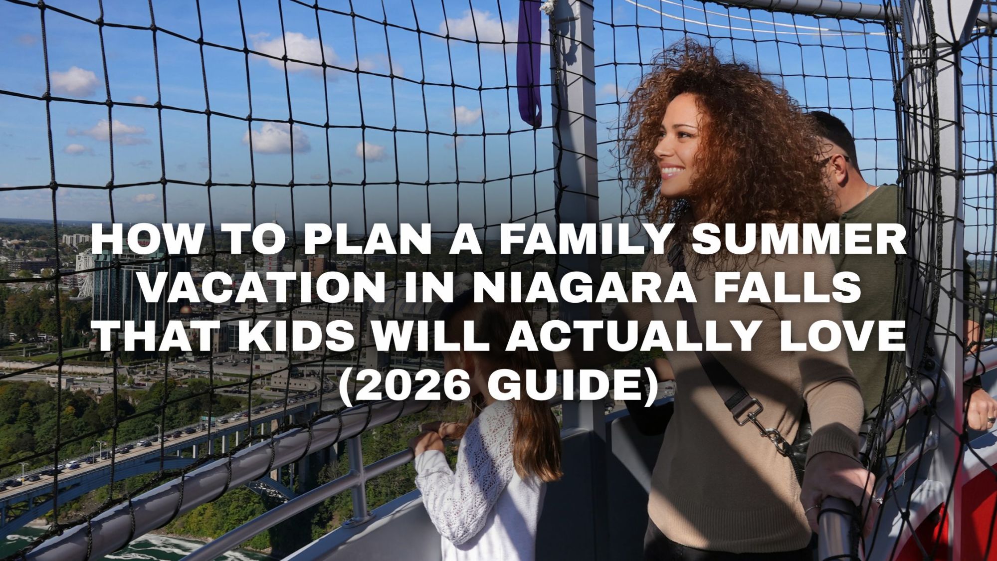 Woman and child on observation deck overlooking city with guide text on image.